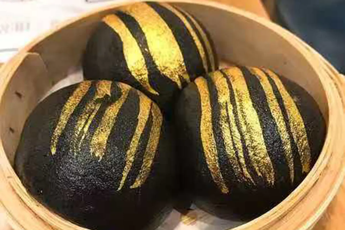 Charcoal Lava Bun at Dim Sum & Kimchi，a Asian Fusion Restaurant in Bettendorf