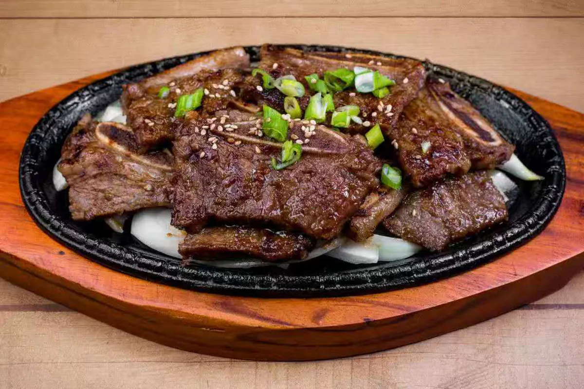 Marinated traditional cut of beef short rib in house special sauce at Dim Sum & Kimchi，a Asian Fusion Restaurant in Bettendorf